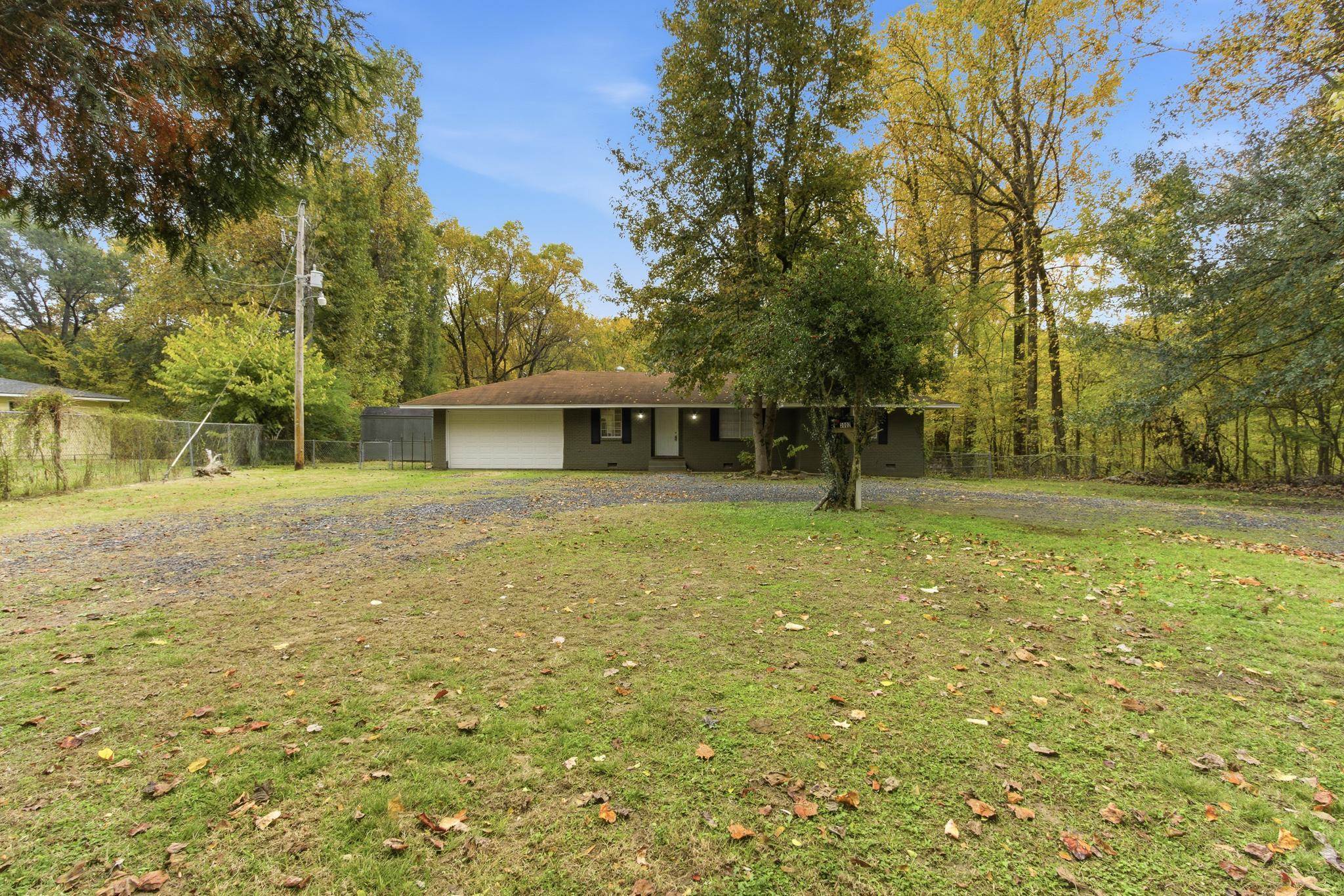 5002 Benjestown Road Memphis, TN 38127 - Photo 2 of 29 Rear view of property with a garage