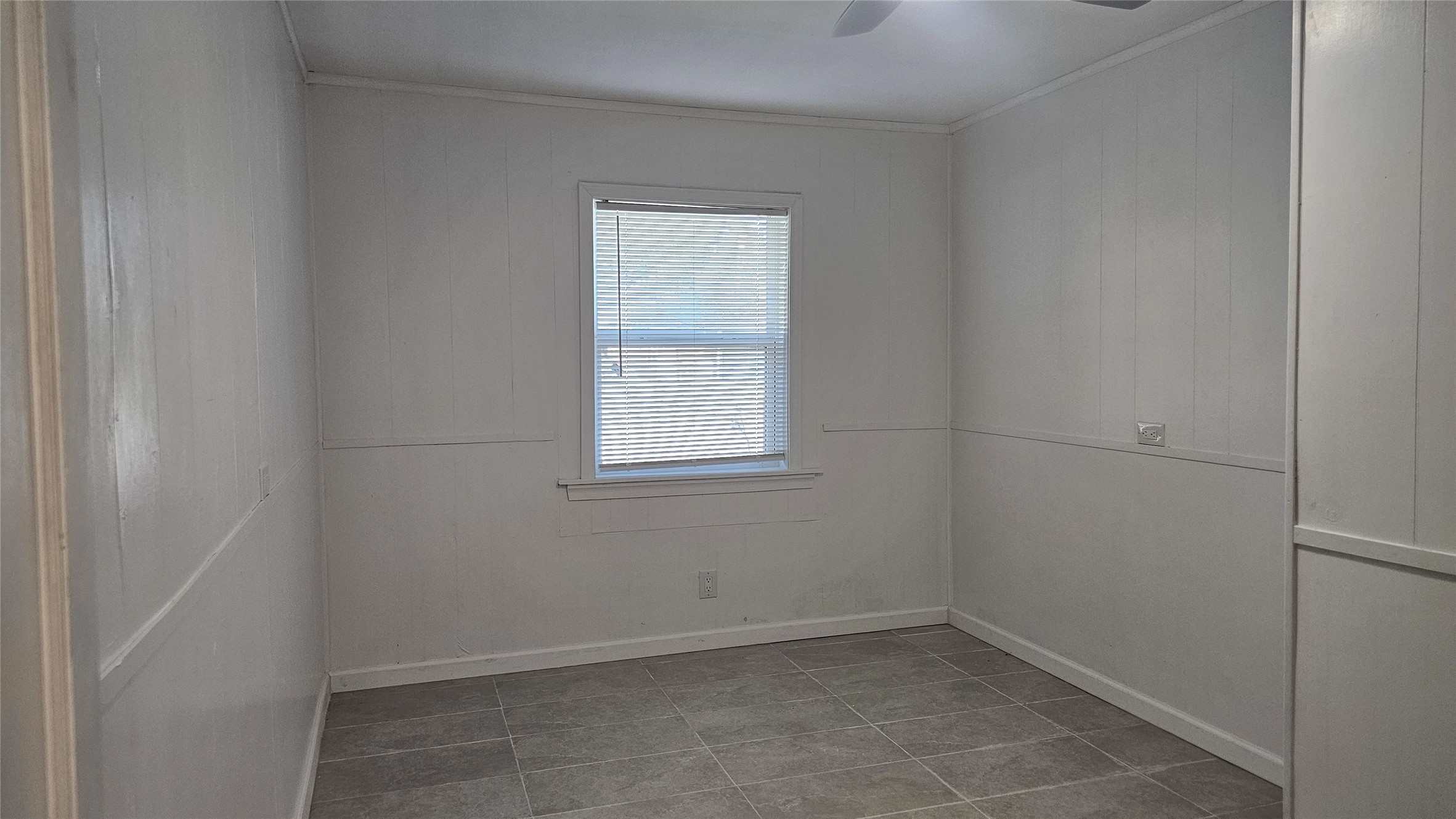 1202 Dyer Avenue, Unit A Rosenberg, TX 77471 - Photo 9 of 14 an empty room with a window