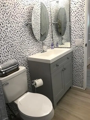 a bathroom with a toilet and a sink