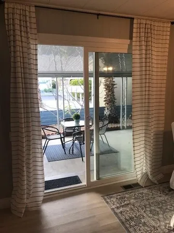 a view of a livingroom with furniture and front door