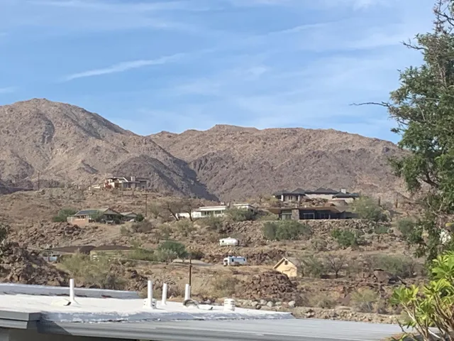 an aerial view of mountains in the background