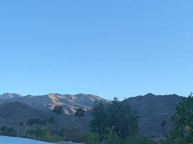 a view of a house with a snow on the road
