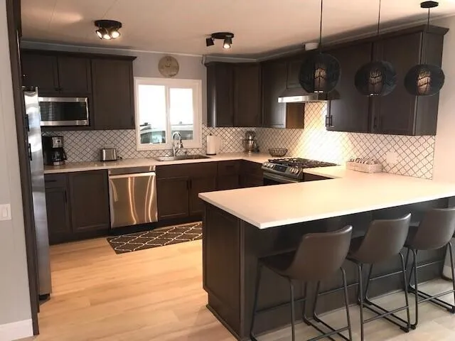 a kitchen with a sink and cabinets