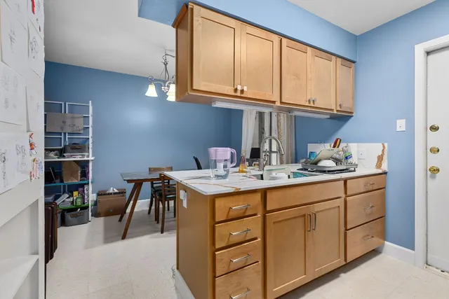 a kitchen with a sink and cabinets