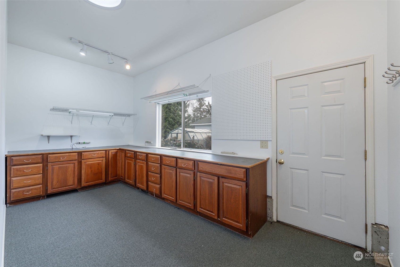 2143 Atterberry Road Sequim, WA 98382 - Photo 32 of 37 a kitchen with sink cabinets and window