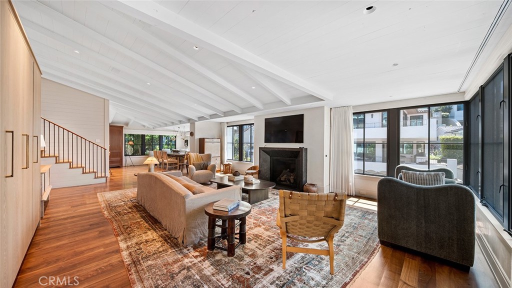 27 Emerald Bay Laguna Beach, CA 92651 - Photo 13 of 47 a living room with furniture and a fireplace