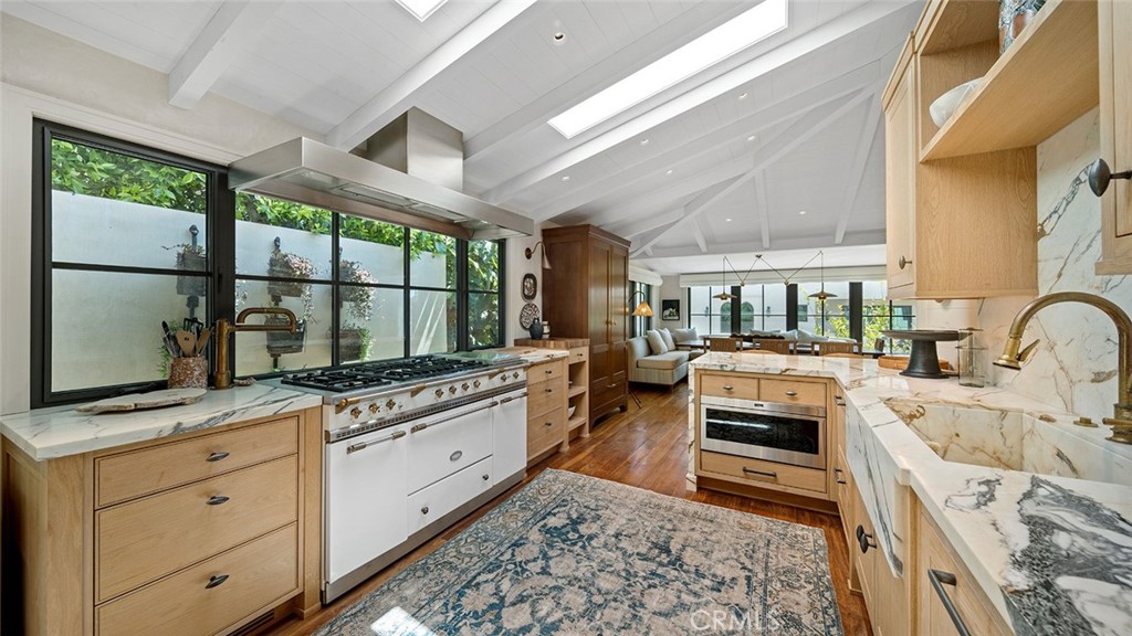 27 Emerald Bay Laguna Beach, CA 92651 - Photo 15 of 47 a kitchen with stainless steel appliances granite countertop a stove a sink and a refrigerator