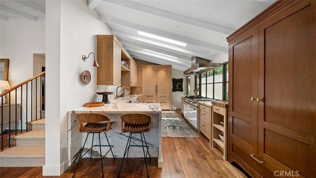 a very nice looking dining room with a large window