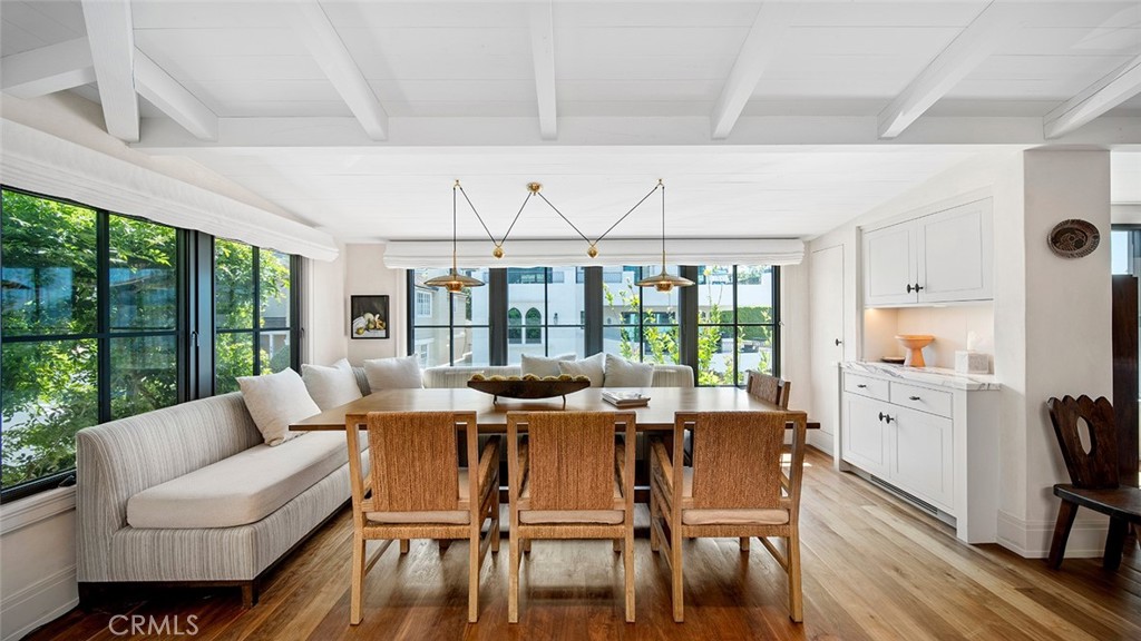 27 Emerald Bay Laguna Beach, CA 92651 - Photo 19 of 47 a view of a dining room with furniture large windows and wooden floor