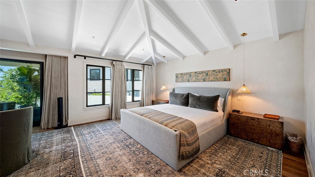 27 Emerald Bay Laguna Beach, CA 92651 - Photo 21 of 47 a spacious bedroom with a large bed and a window