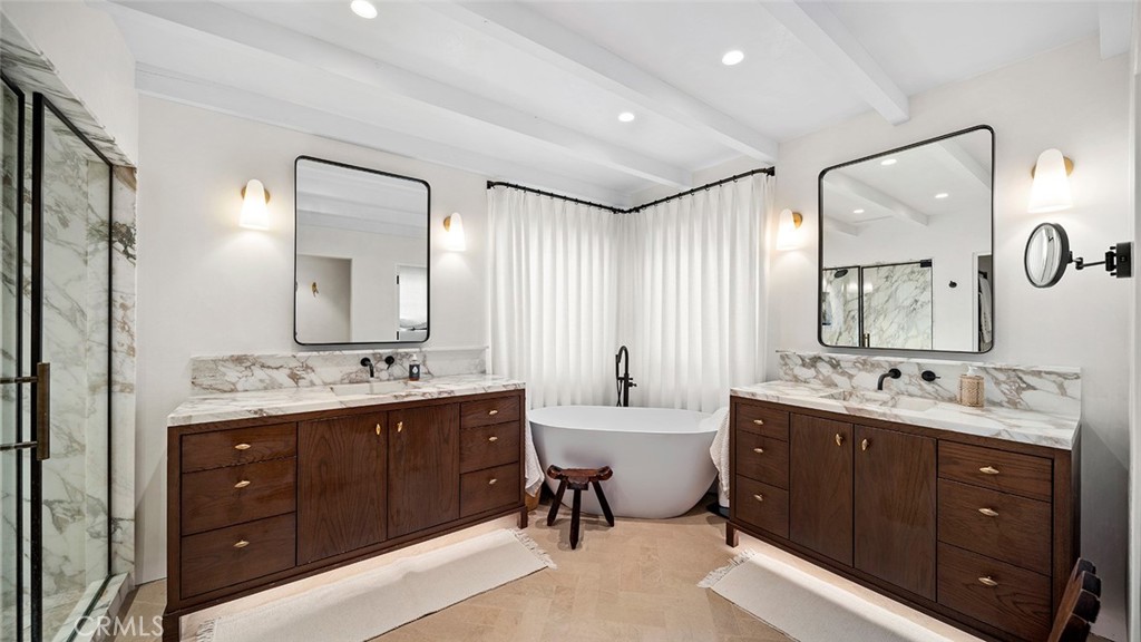 27 Emerald Bay Laguna Beach, CA 92651 - Photo 23 of 47 a spacious bathroom with a double vanity sink mirror double and bathtub