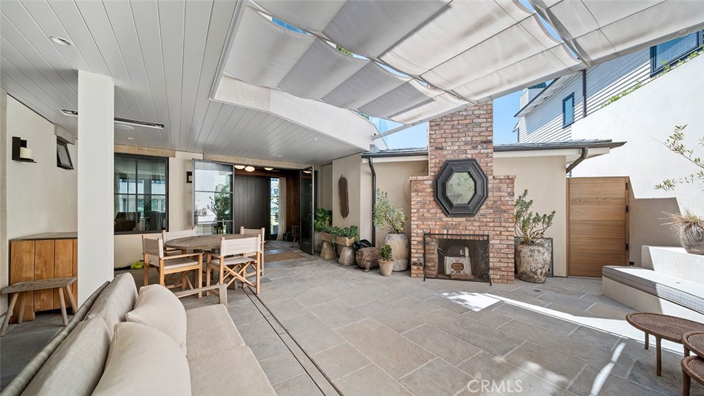 27 Emerald Bay Laguna Beach, CA 92651 - Photo 28 of 47 a living room with furniture a fireplace and a table