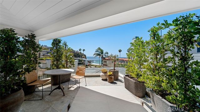 a dining room with furniture and a window