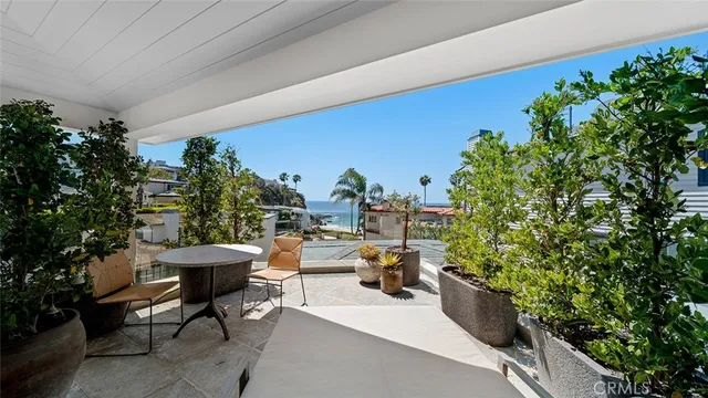 a dining room with furniture and a window
