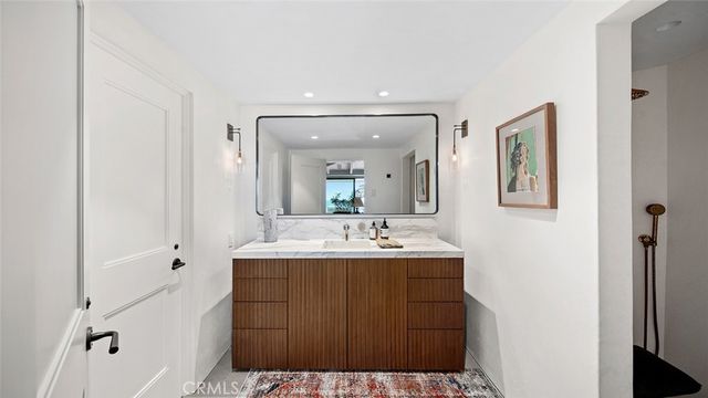 a bedroom with a bed and glass window