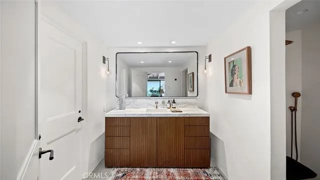 a bedroom with a bed and glass window