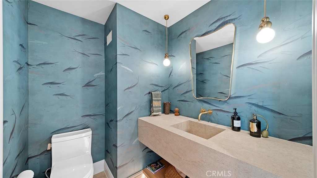 27 Emerald Bay Laguna Beach, CA 92651 - Photo 34 of 47 a bathroom with a sink vanity mirror and toilet