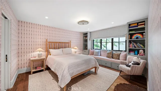 a bathroom with a granite countertop double vanity sink and a mirror