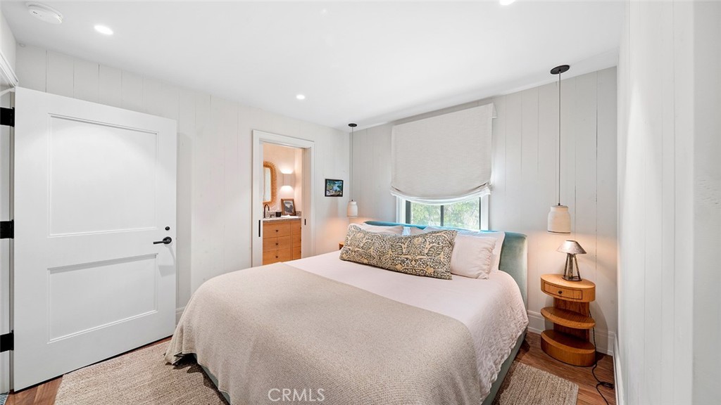 27 Emerald Bay Laguna Beach, CA 92651 - Photo 38 of 47 a bedroom with a bed and a window