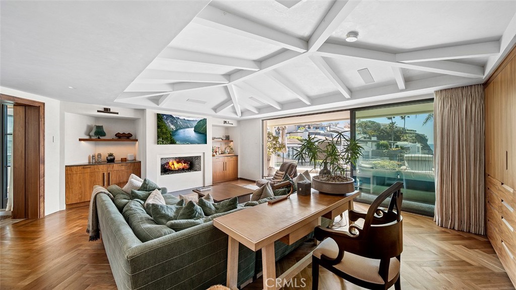 27 Emerald Bay Laguna Beach, CA 92651 - Photo 8 of 47 a living room with furniture a wooden floor and a large window