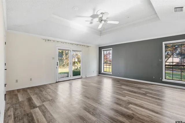 a view of a bathroom with a sink and a mirror