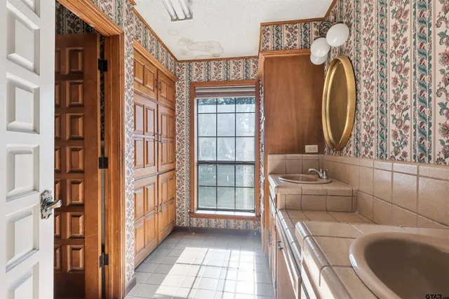 a bathroom with a sink and a mirror