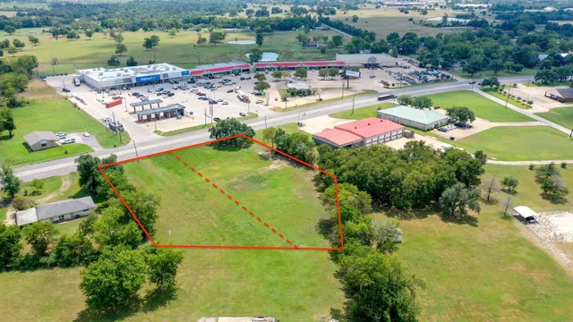 an aerial view of a house with a lake view