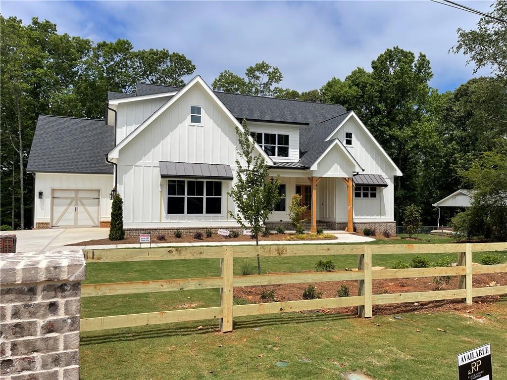 6770 Pannell Road Buford, GA 30518 - Photo 1 of 1 a front view of a house with a yard