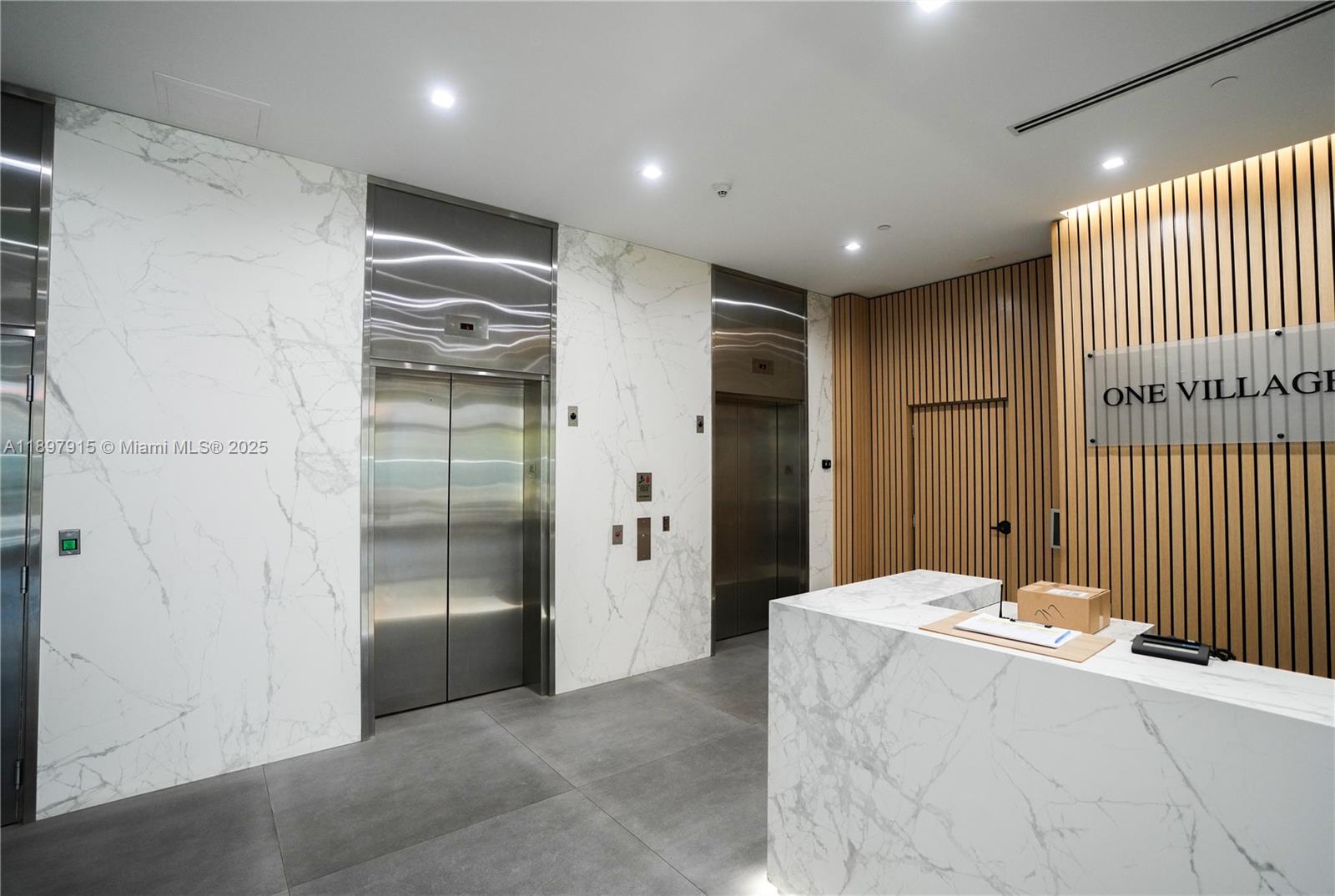 4100 Salzedo Street, Unit 916 Coral Gables, FL 33146 - Photo 14 of 24 a living room with stainless steel appliances kitchen island granite countertop furniture and a shower