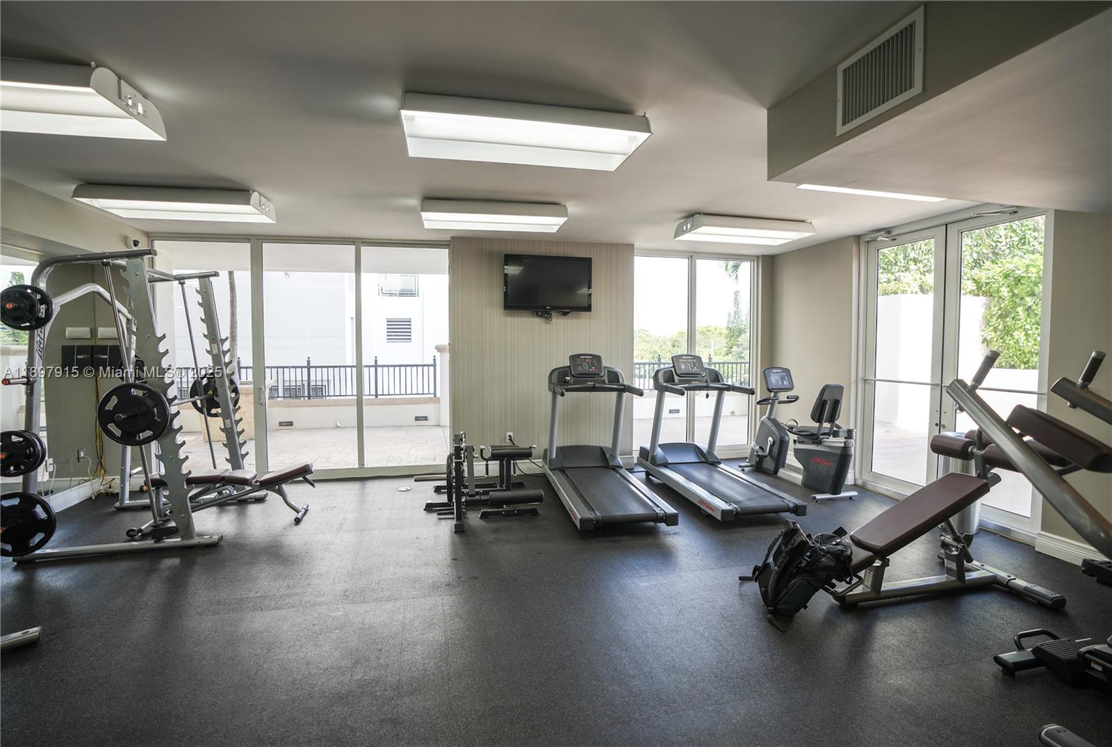 4100 Salzedo Street, Unit 916 Coral Gables, FL 33146 - Photo 18 of 24 a view of a room with gym equipment