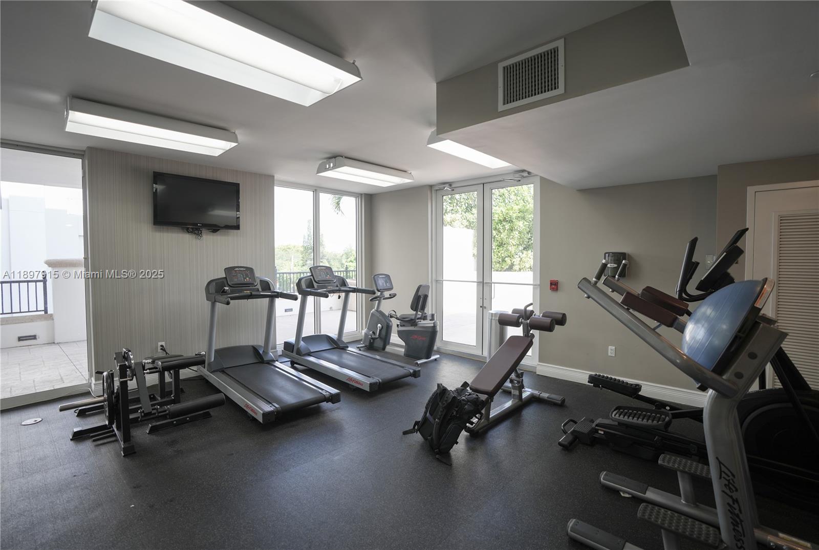 4100 Salzedo Street, Unit 916 Coral Gables, FL 33146 - Photo 19 of 24 a view of a room with gym equipment