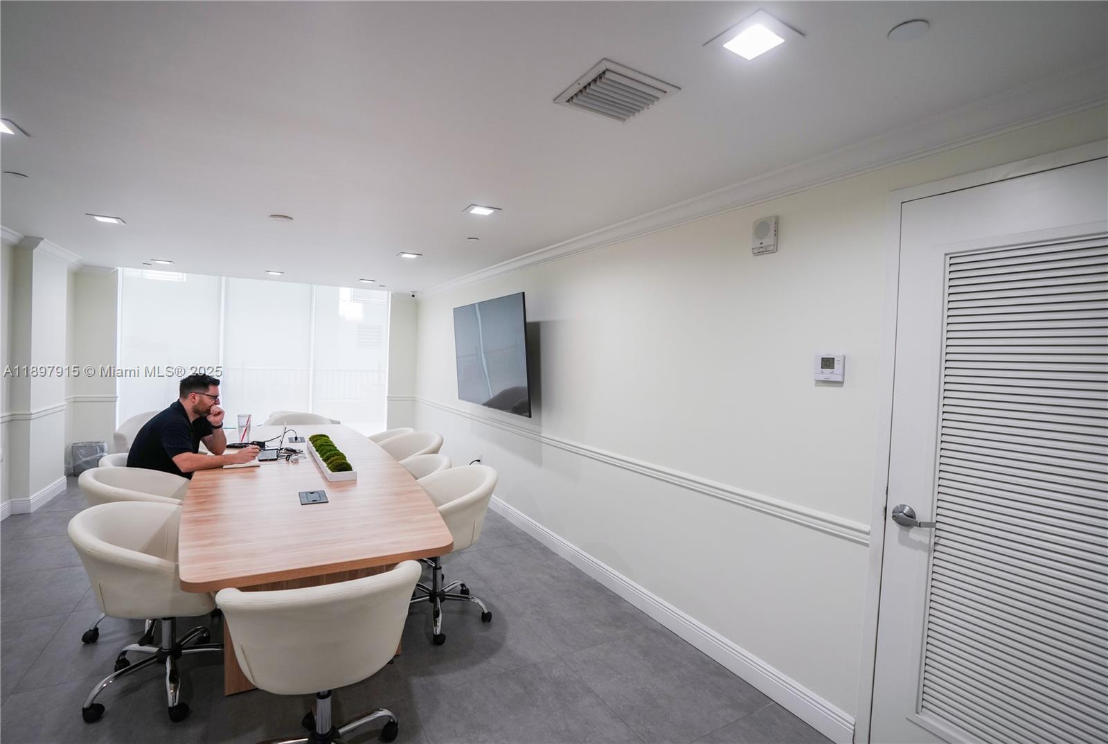 4100 Salzedo Street, Unit 916 Coral Gables, FL 33146 - Photo 21 of 24 a view of a dining room with furniture and a window