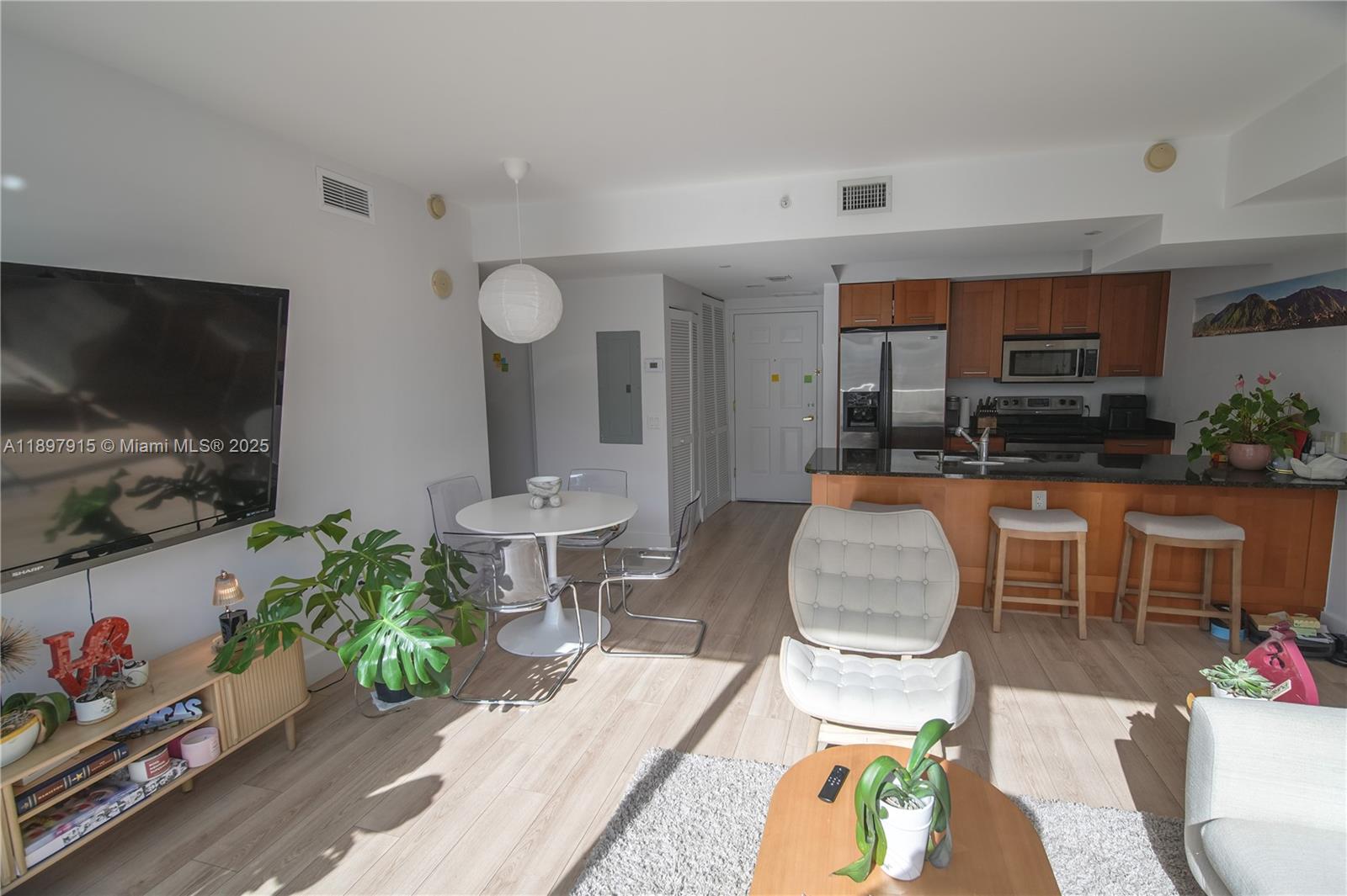 4100 Salzedo Street, Unit 916 Coral Gables, FL 33146 - Photo 3 of 24 a living room with furniture and a flat screen tv