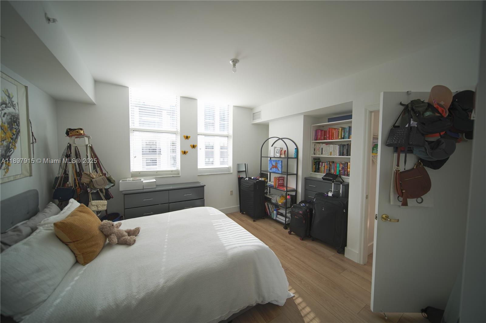 4100 Salzedo Street, Unit 916 Coral Gables, FL 33146 - Photo 6 of 24 a bedroom with a bed closet and a window