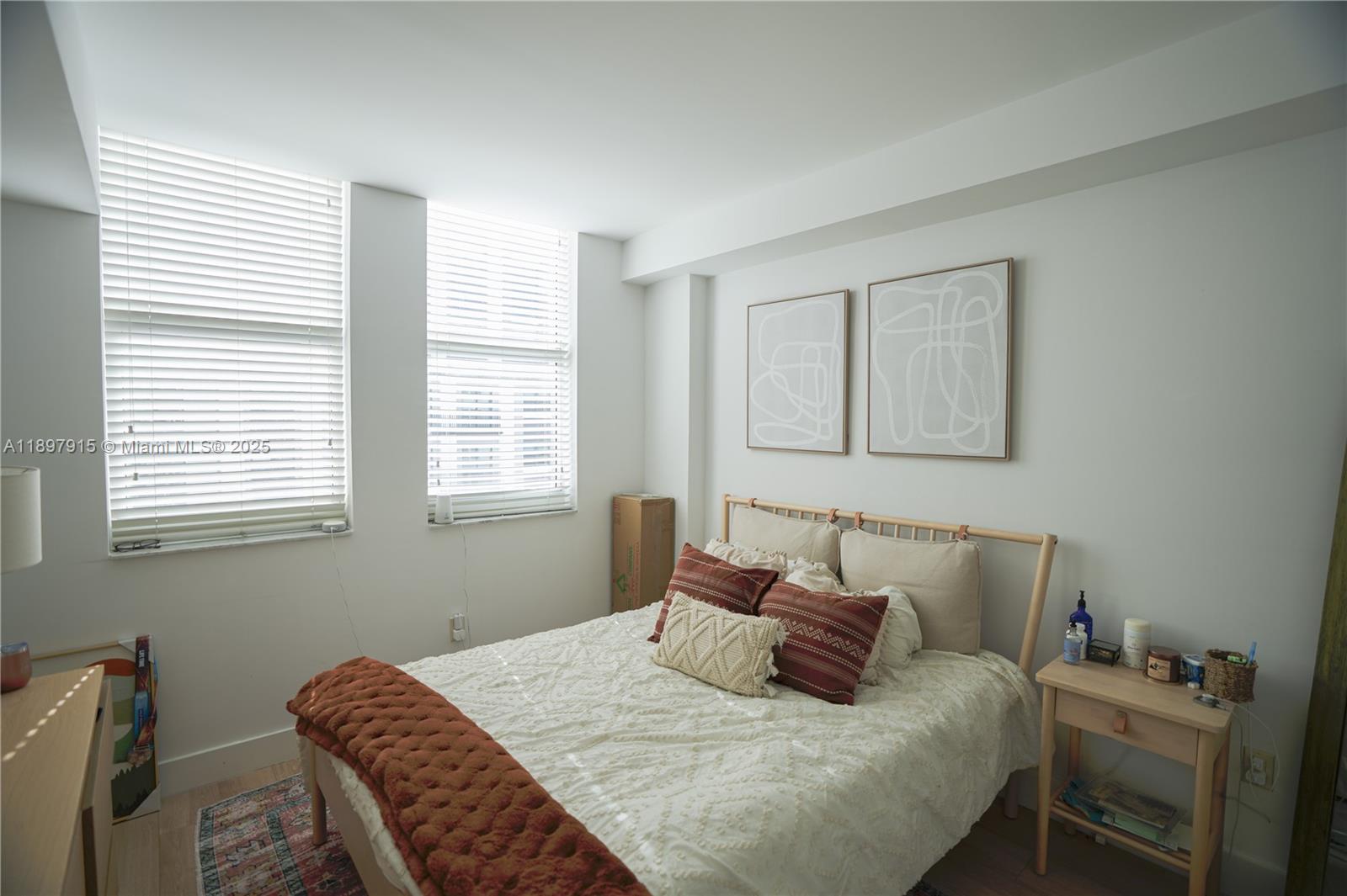 4100 Salzedo Street, Unit 916 Coral Gables, FL 33146 - Photo 9 of 24 a bedroom with a bed and a window