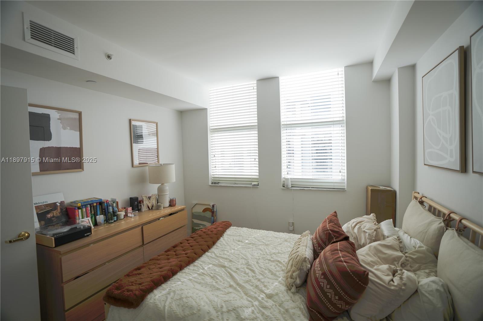 4100 Salzedo Street, Unit 916 Coral Gables, FL 33146 - Photo 10 of 24 a bed room with a bed and a window