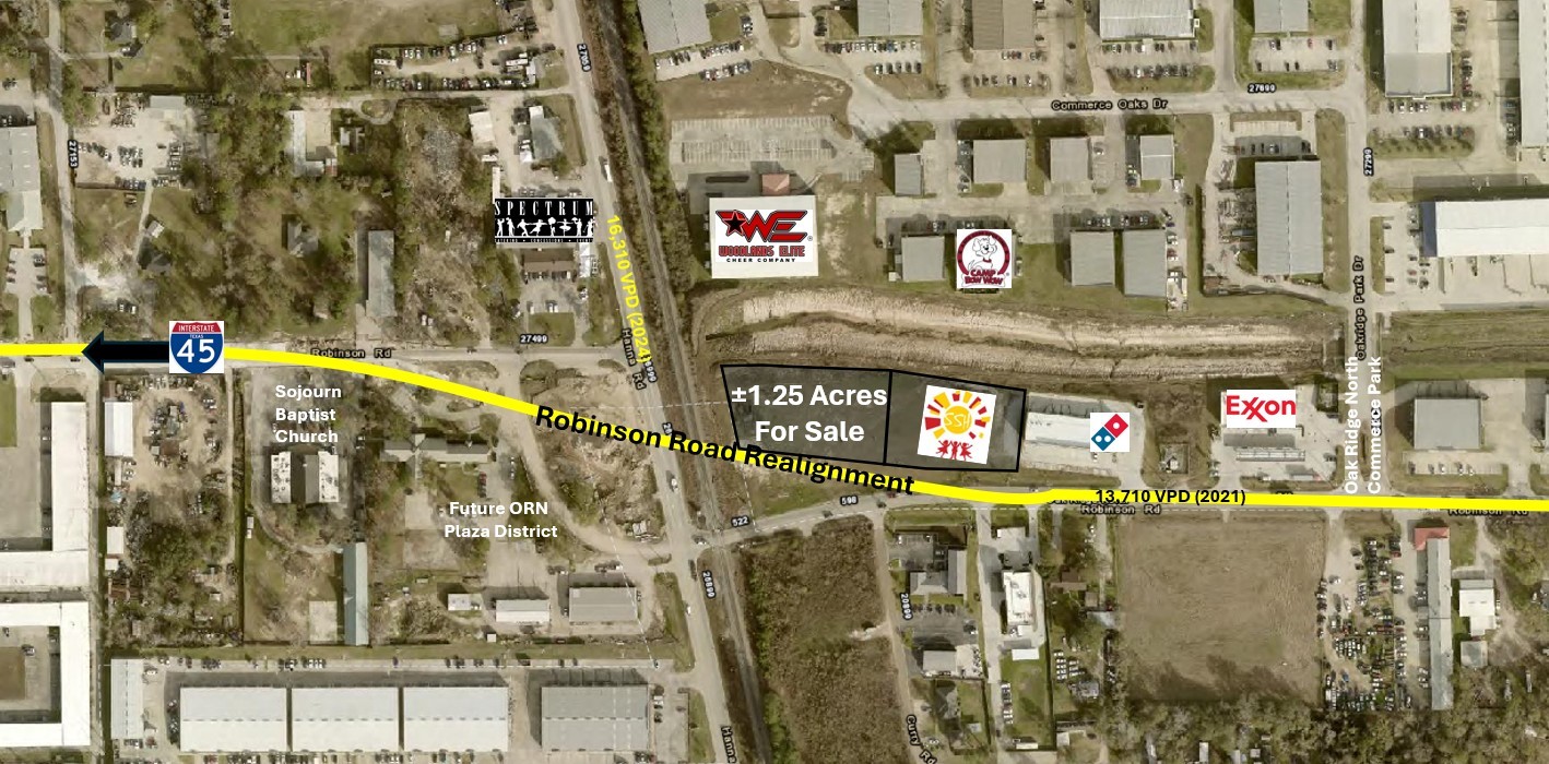 a street sign on a wall next to a building