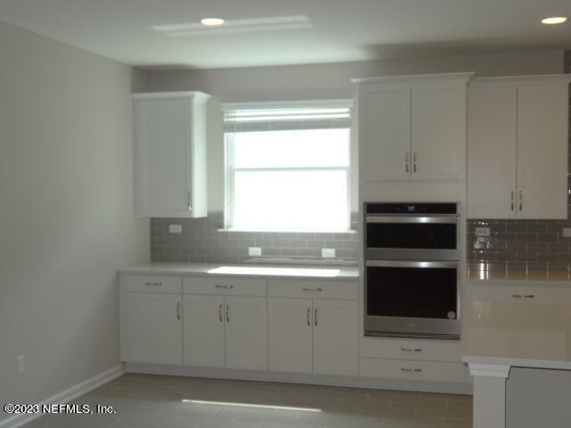 69 Trewin Circle St. Augustine, FL 32092 - Photo 12 of 36 a kitchen with a sink and cabinets
