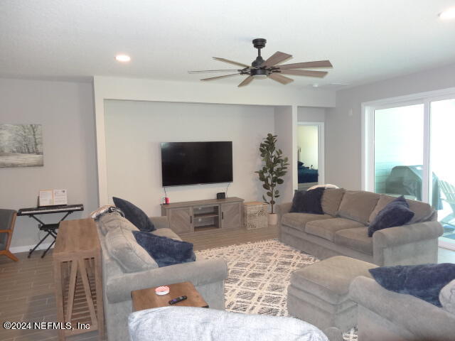 69 Trewin Circle St. Augustine, FL 32092 - Photo 14 of 36 a living room with furniture and a flat screen tv
