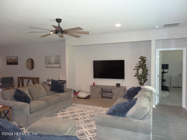 69 Trewin Circle St. Augustine, FL 32092 - Photo 15 of 36 a living room with furniture and a flat screen tv
