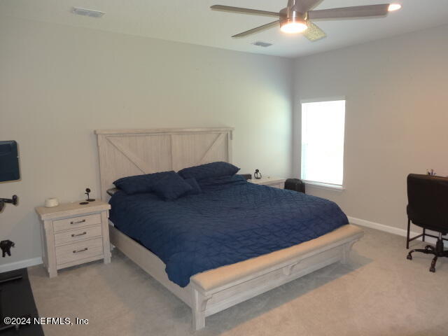 69 Trewin Circle St. Augustine, FL 32092 - Photo 19 of 36 a bedroom with a bed and a dresser