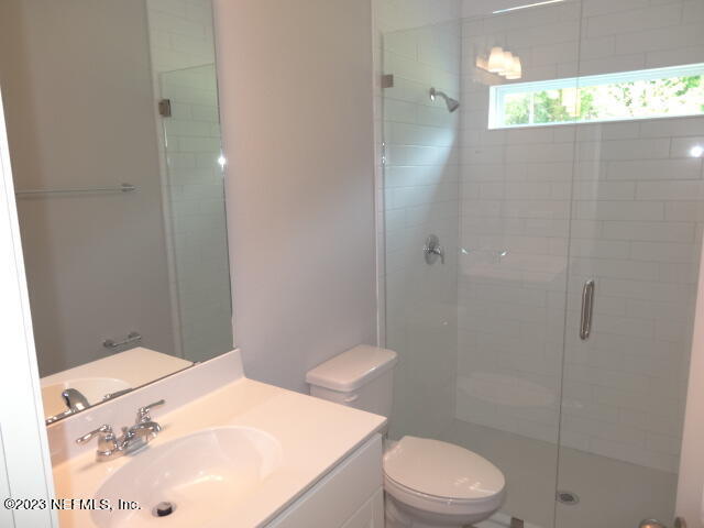 69 Trewin Circle St. Augustine, FL 32092 - Photo 27 of 36 a bathroom with a sink a toilet and shower