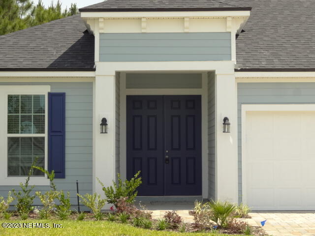 69 Trewin Circle St. Augustine, FL 32092 - Photo 3 of 36 a front view of a house with plants