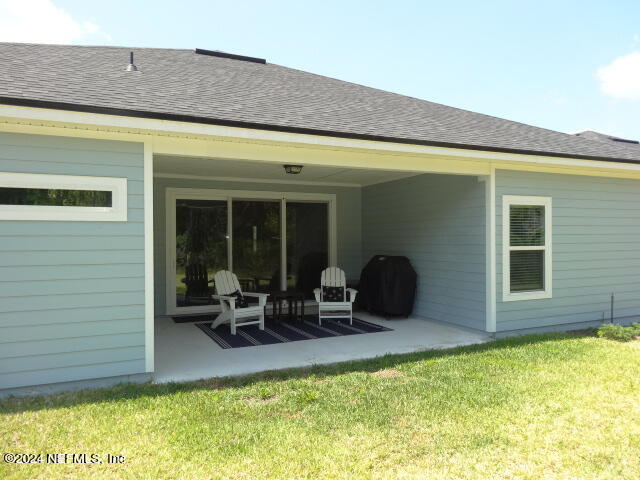 69 Trewin Circle St. Augustine, FL 32092 - Photo 31 of 36 a view of house with outdoor seating space