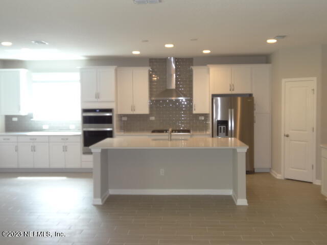 69 Trewin Circle St. Augustine, FL 32092 - Photo 10 of 36 a view of kitchen with stainless steel appliances granite countertop refrigerator sink and stove