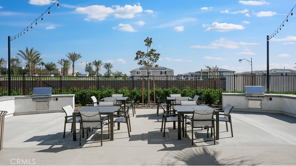 1700 Phantom Lane Rialto, CA 92376 - Photo 19 of 23 a view of a patio with a table and chairs and potted plants