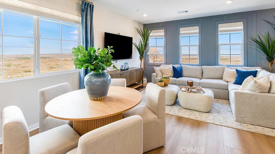 1700 Phantom Lane Rialto, CA 92376 - Photo 5 of 23 a living room with furniture potted plant and windows