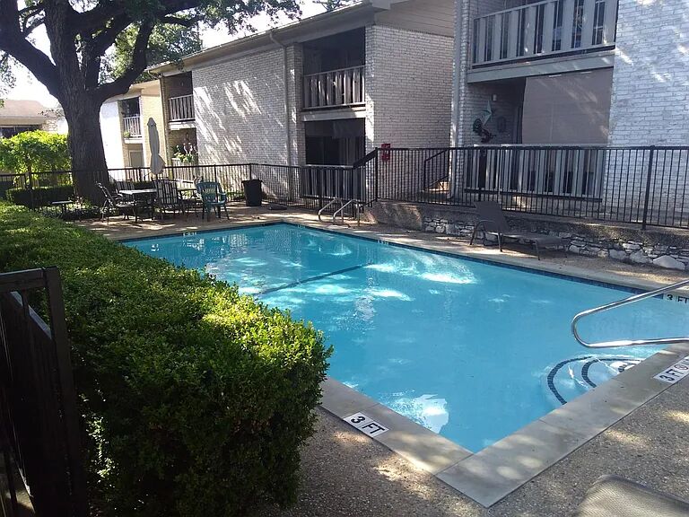 1304 Summit Street, Unit 208 Austin, TX 78741 - Photo 12 of 18 Community pool with lots of seating for you to relax or gather with friends!
