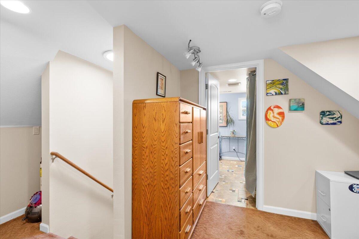 440 Bush Street Central Point, OR 97502 - Photo 19 of 40 a view of a hallway with painted walls