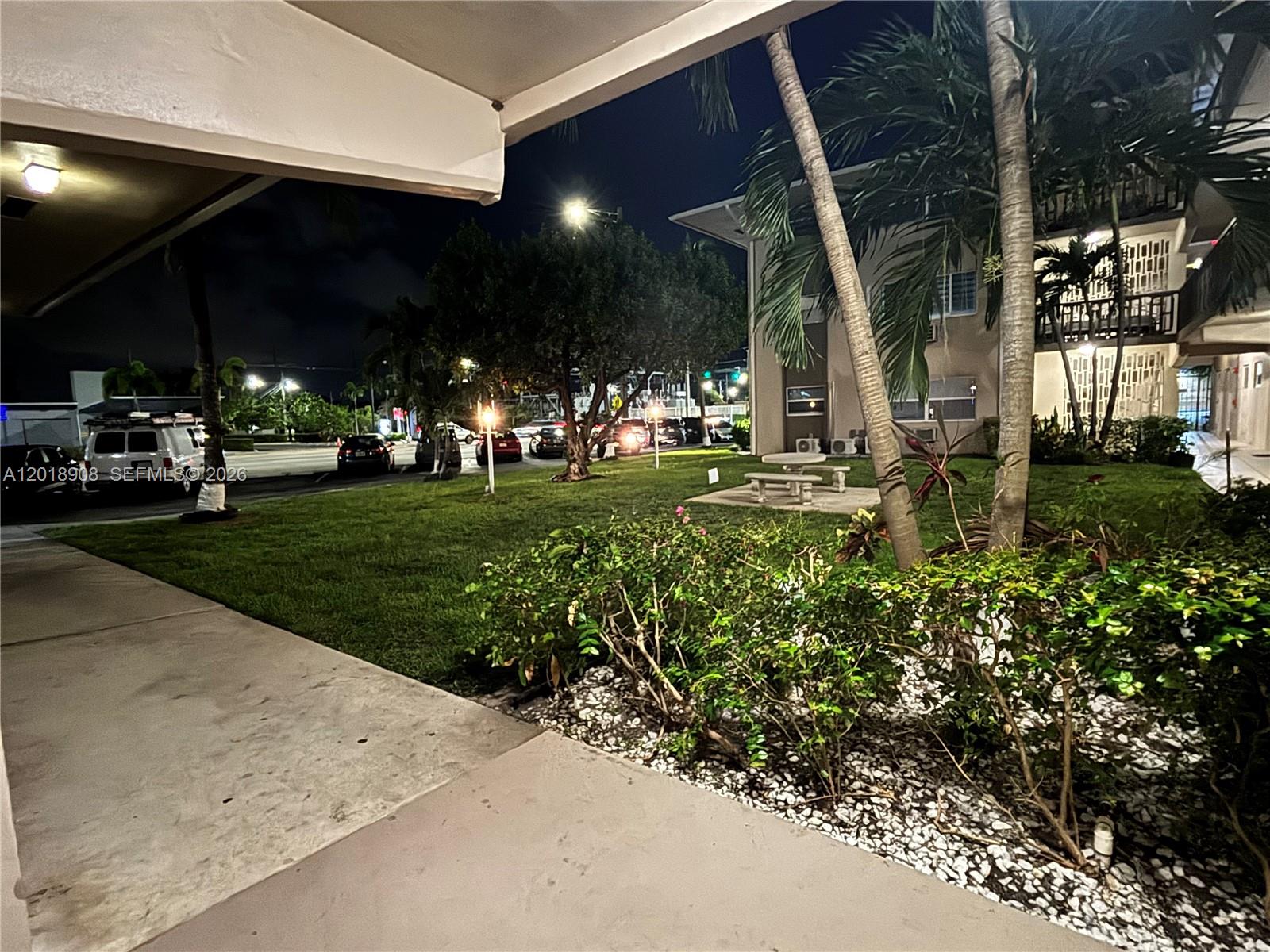 1480 East Sample Road, Unit 209 Pompano Beach, FL 33064 - Photo 3 of 24 a view of a house with a yard